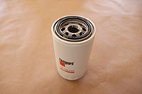 new oil filter filled and gasket lubricated