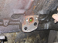 Cleaning engine block mounting surfaces