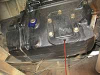 PTO bolt removed, transmission draining